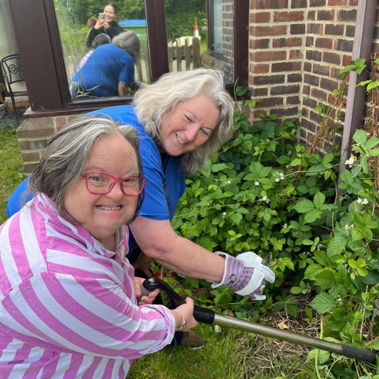 About us - a supported person in accommodation services doing some gardening