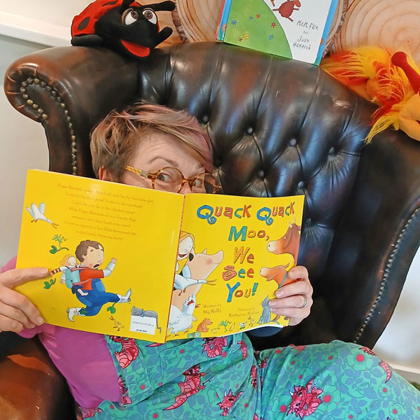 Image of lady with children's book