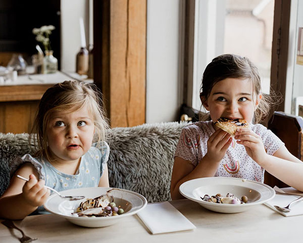 girls eating dessert in a restaurant