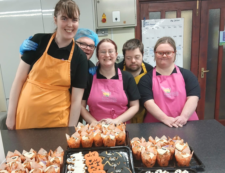 catering students in the kitchen smiling