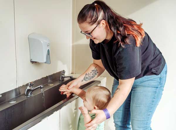 Handwashing mum and toddler